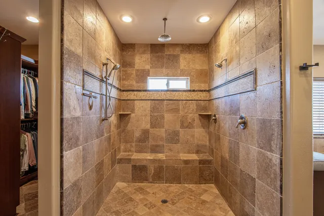 a bathroom with a sink double vanity and tub