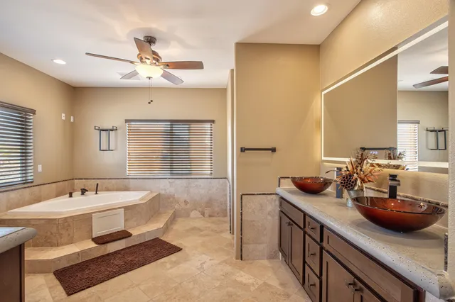 a bathroom with a granite countertop sink mirror and