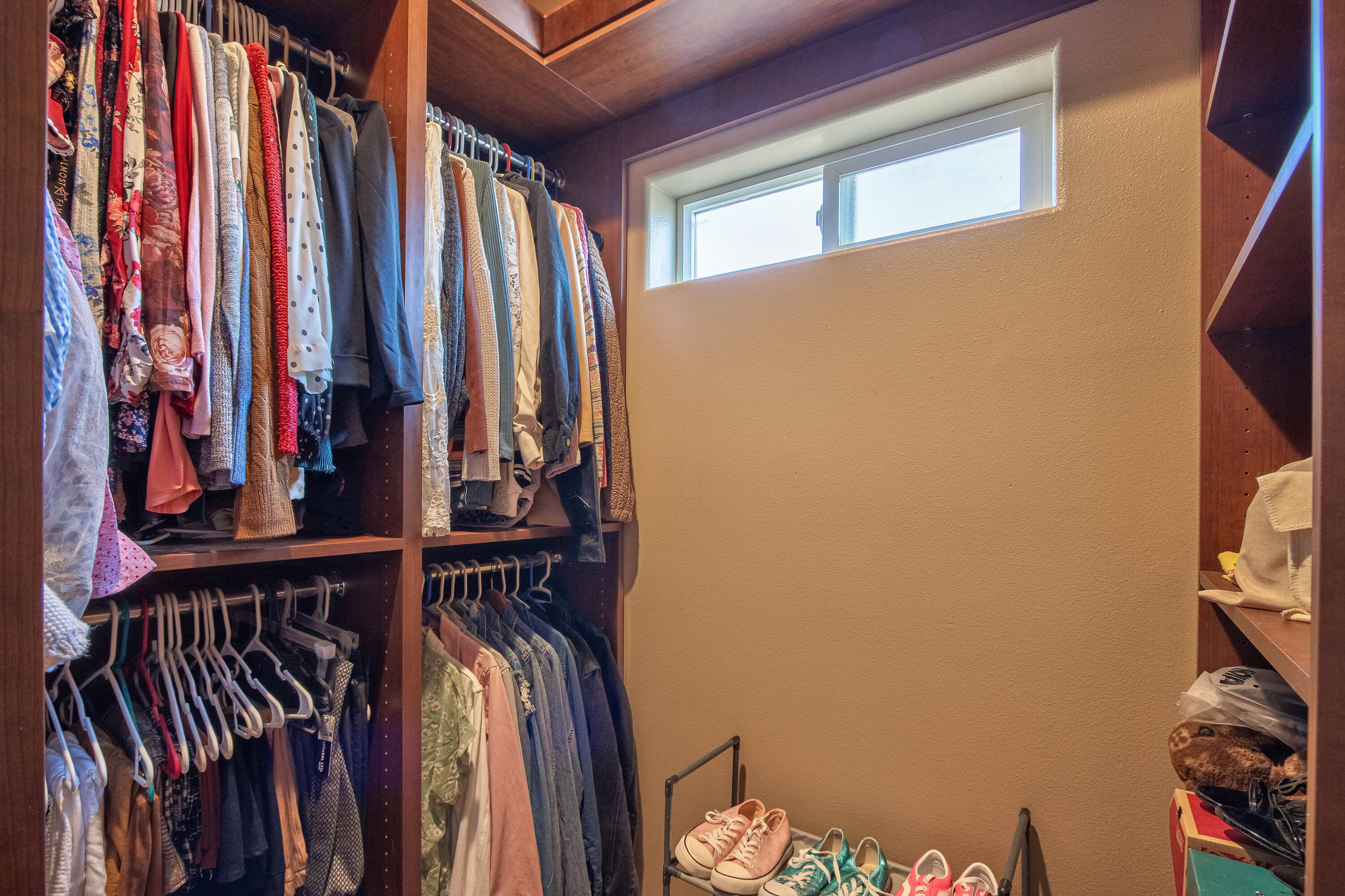 7225 Adobe Road Twentynine Palms, CA 92277 - Photo 25 of 61 a view of walk in closet with clothes and shoes
