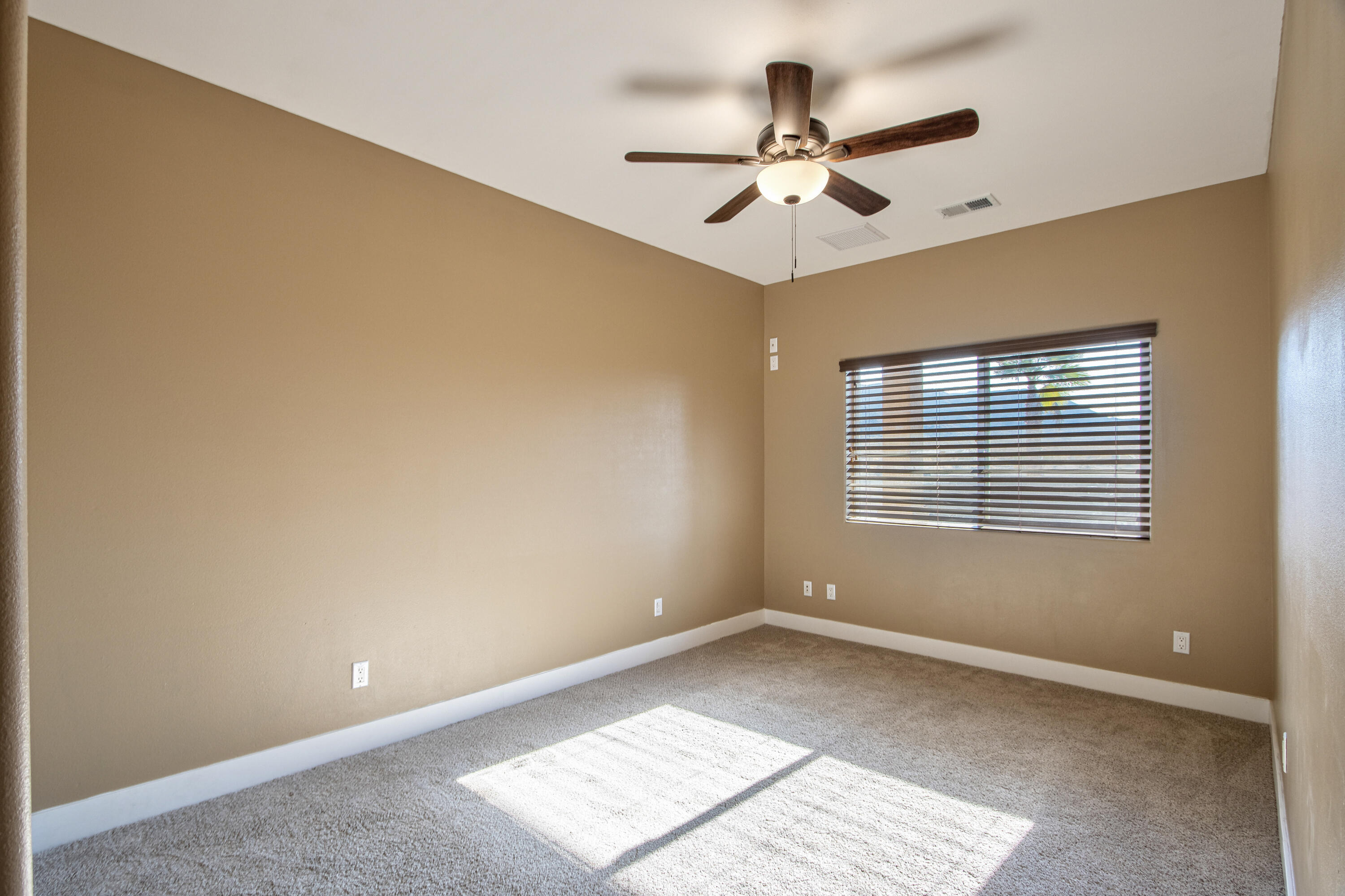 7225 Adobe Road Twentynine Palms, CA 92277 - Photo 26 of 61 a view of an empty room with a window