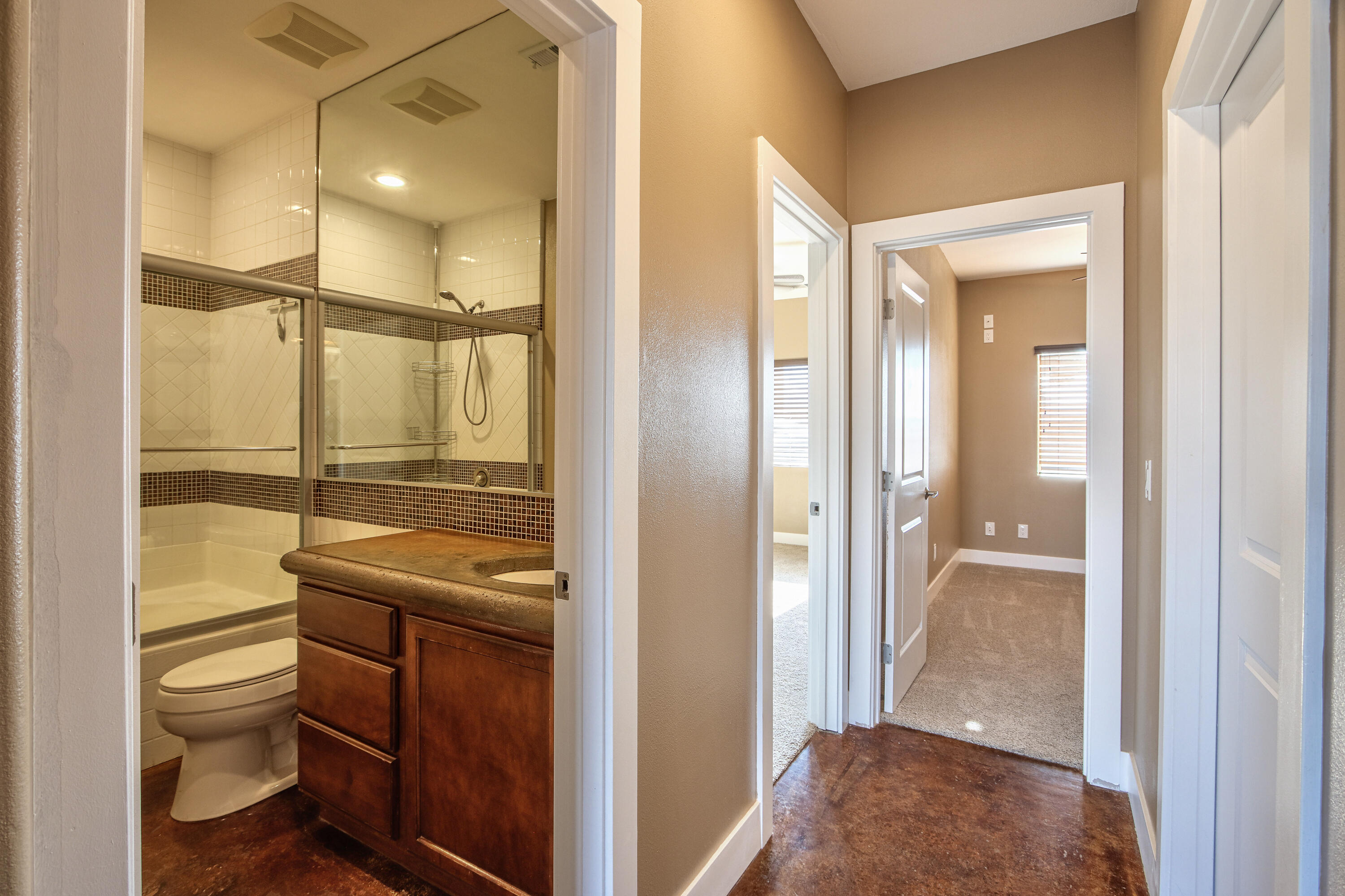7225 Adobe Road Twentynine Palms, CA 92277 - Photo 27 of 61 a bathroom with a granite countertop sink mirror vanity and toilet