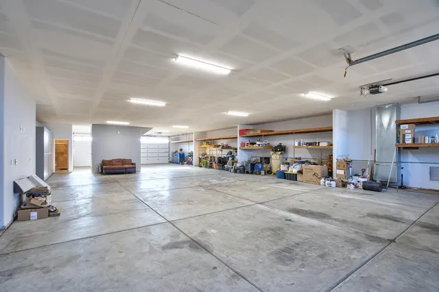 a view of a livingroom with furniture and a ceiling fan