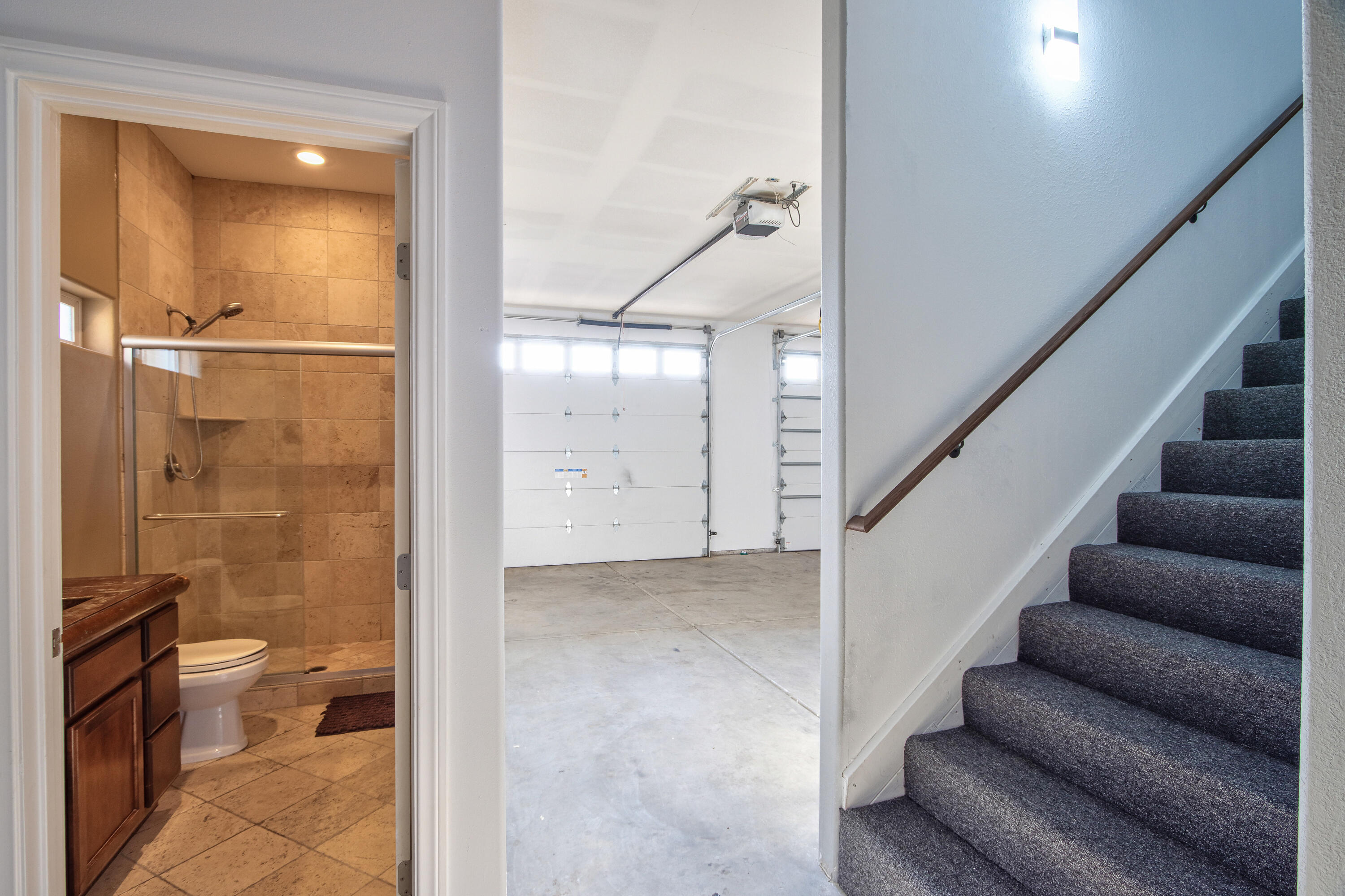 7225 Adobe Road Twentynine Palms, CA 92277 - Photo 34 of 61 a view of a hallway with wooden floor and a bathroom view