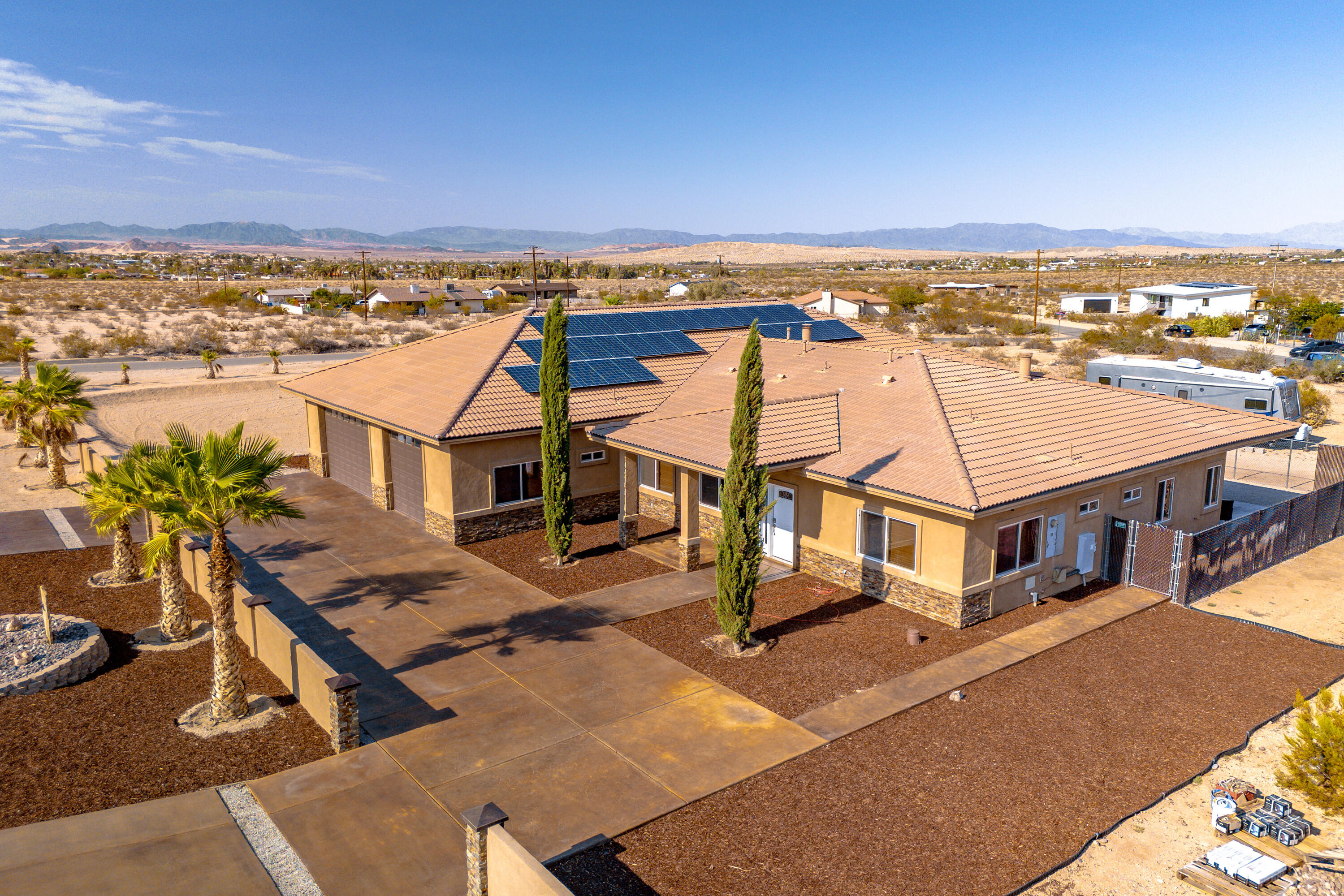 7225 Adobe Road Twentynine Palms, CA 92277 - Photo 4 of 61 an aerial view of a house with a terrace