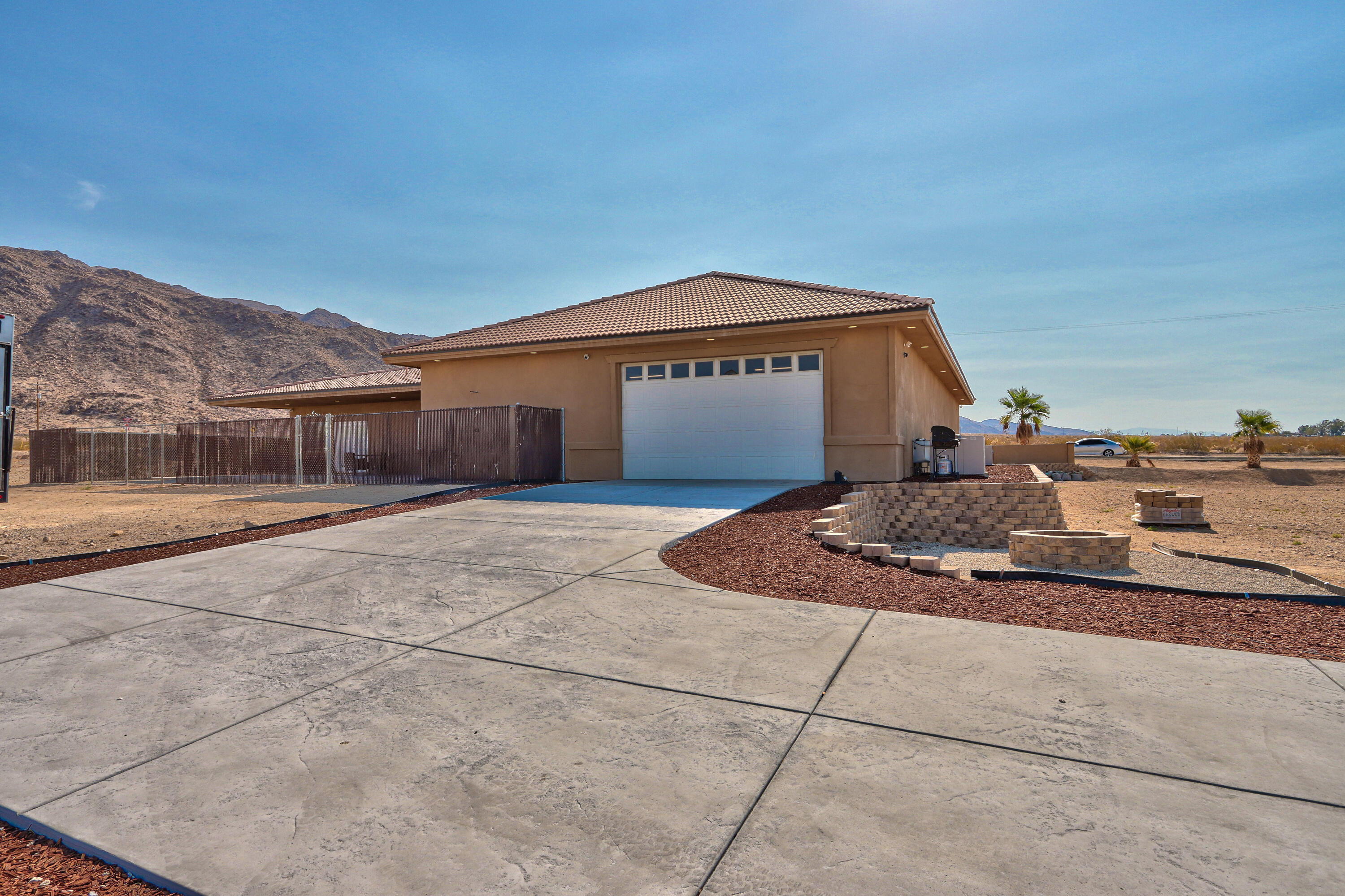 7225 Adobe Road Twentynine Palms, CA 92277 - Photo 42 of 61 a front view of a house with a yard