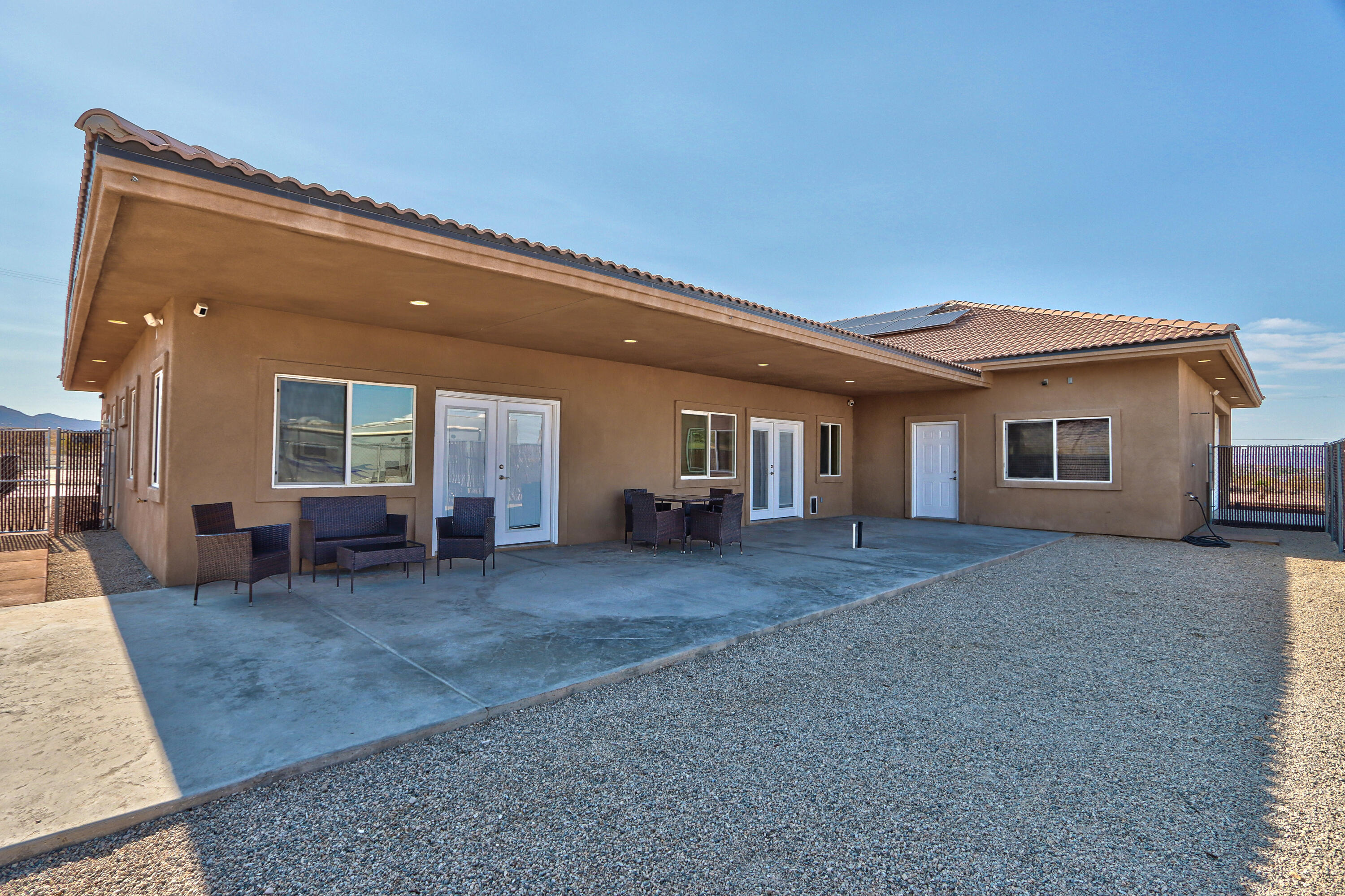 7225 Adobe Road Twentynine Palms, CA 92277 - Photo 45 of 61 a view of a house with backyard and sitting area