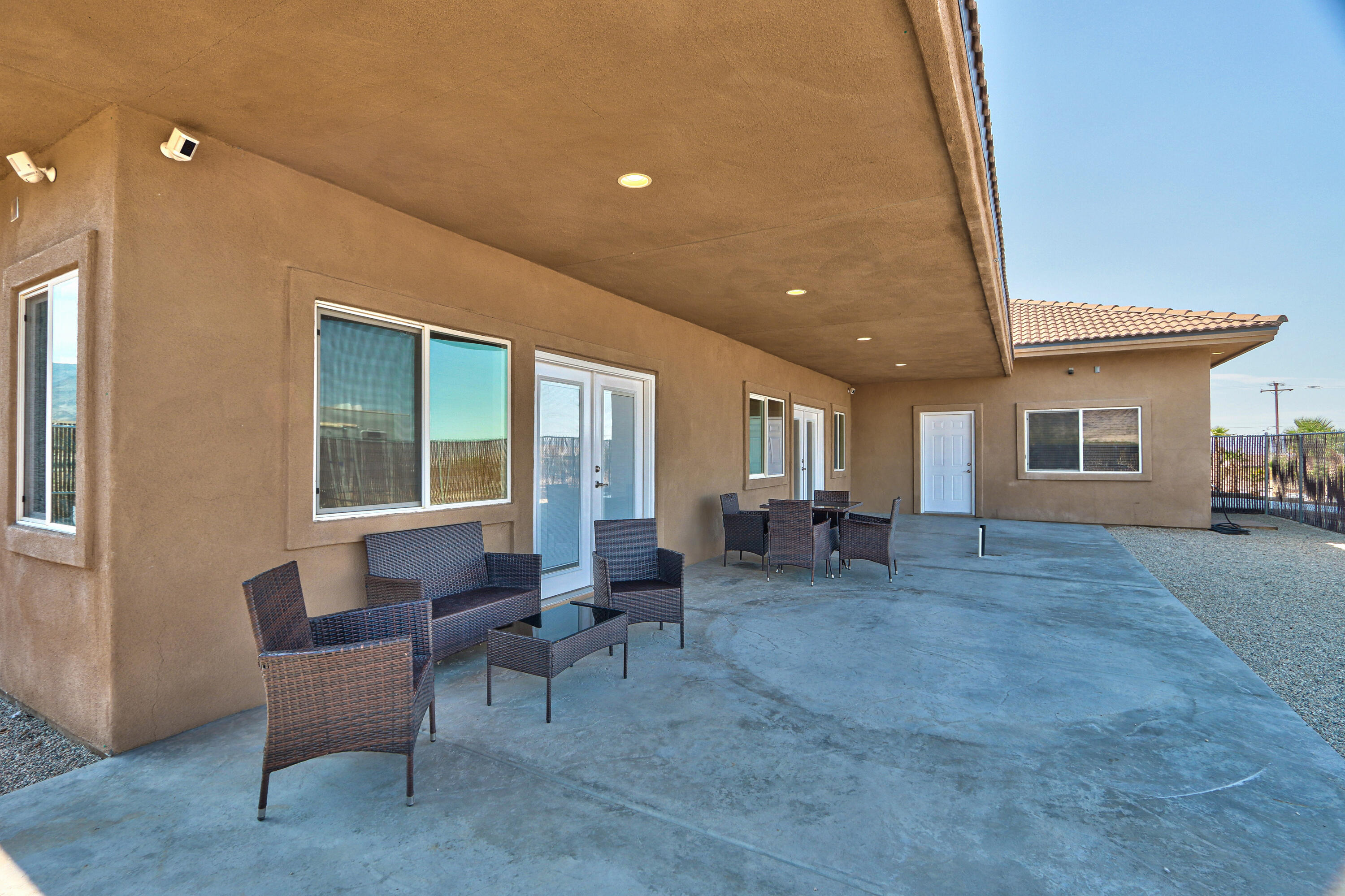 7225 Adobe Road Twentynine Palms, CA 92277 - Photo 46 of 61 a living room with furniture and large windows