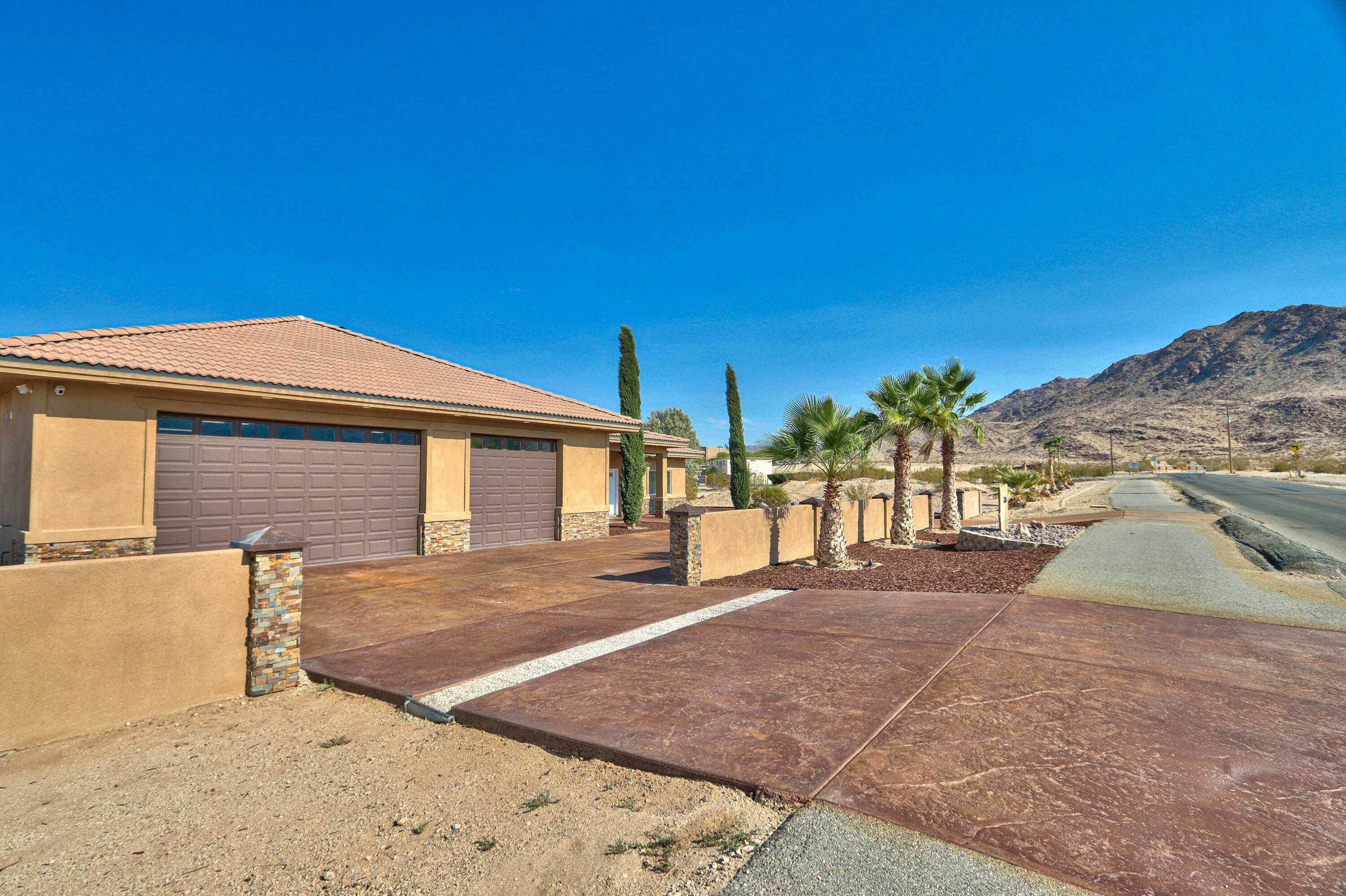 7225 Adobe Road Twentynine Palms, CA 92277 - Photo 6 of 61 a front view of a house with a yard