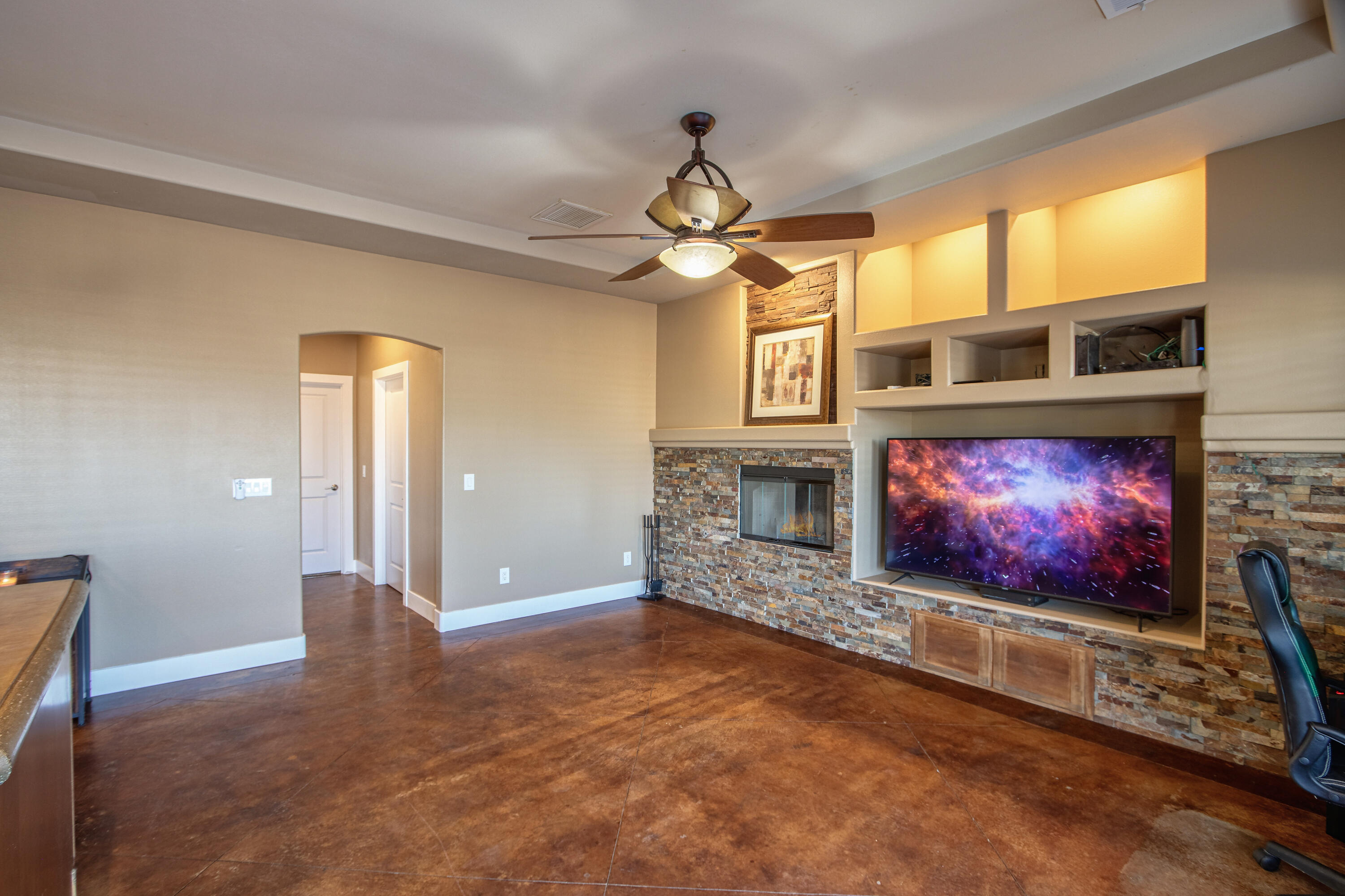 7225 Adobe Road Twentynine Palms, CA 92277 - Photo 10 of 61 a living room with fireplace furniture and a flat screen tv