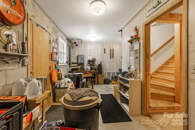 a room with furniture a rug and a window