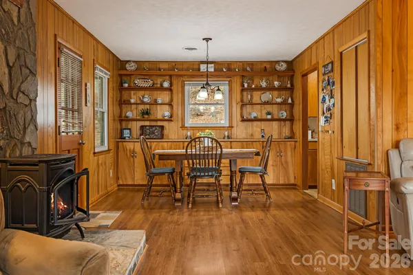 a view of a livingroom with furniture window and wooden floor