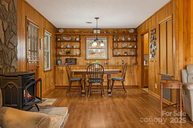 a view of a livingroom with furniture window and wooden floor