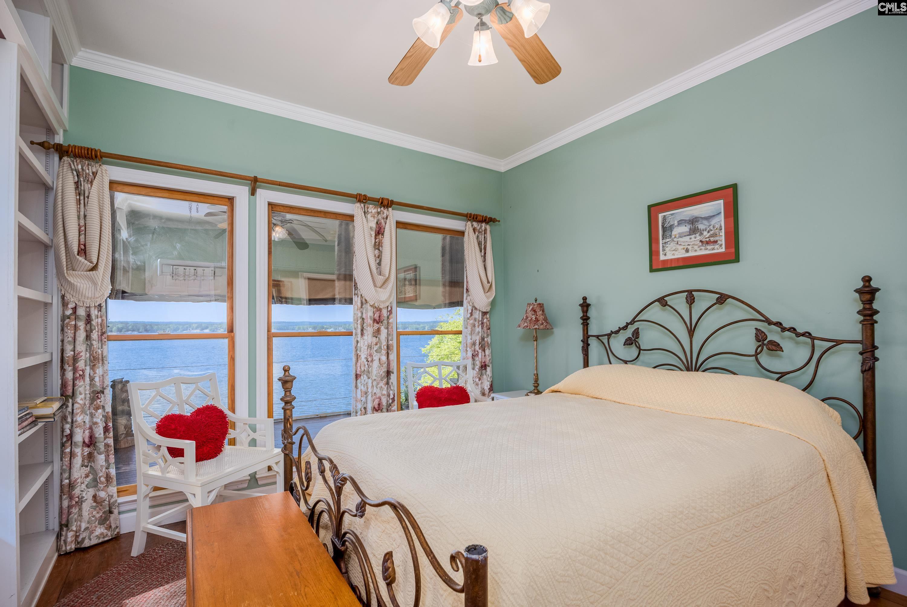 2577 Harbor View Road Camden, SC 29020 - Photo 29 of 42 a bed room with a bed and a chandelier