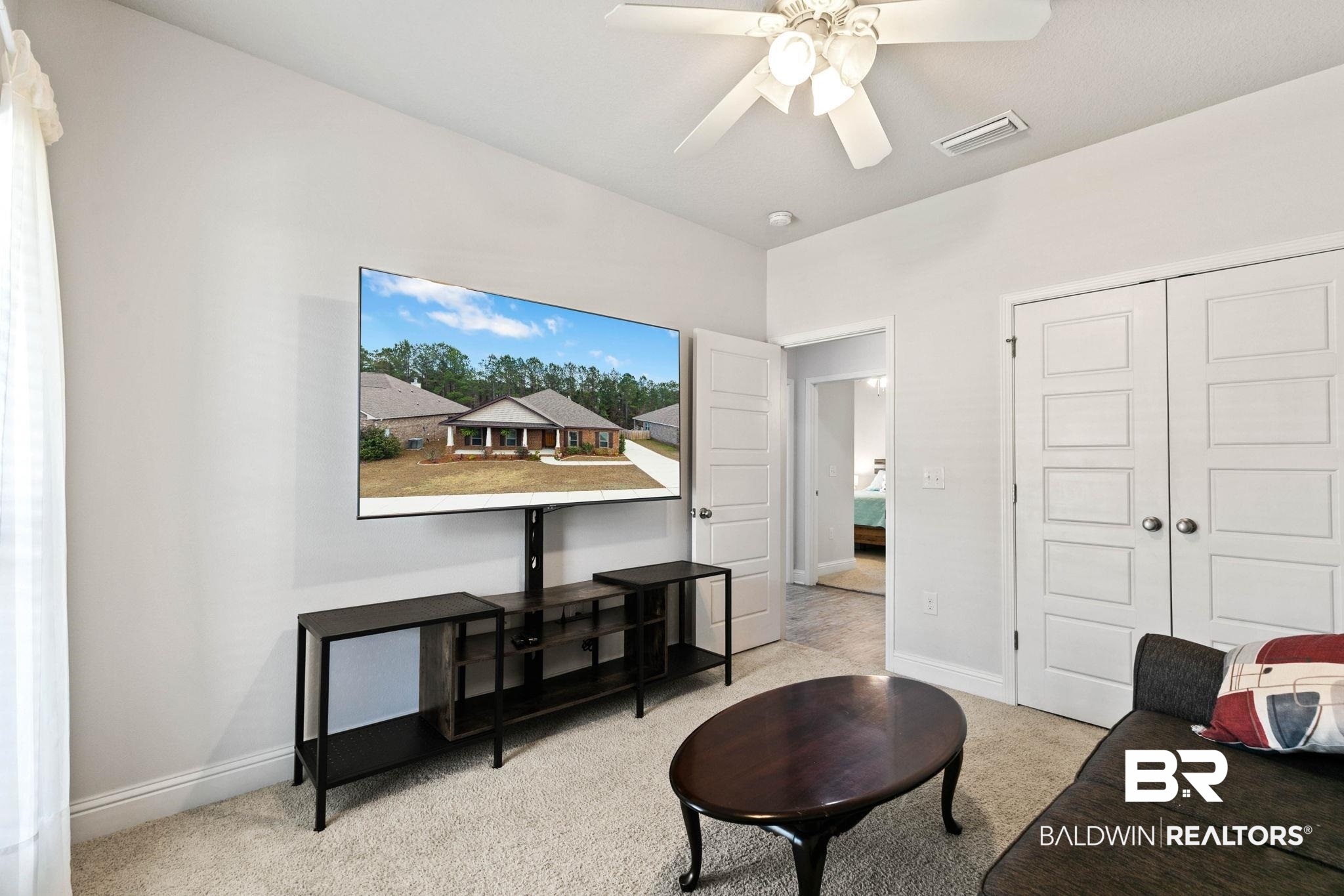 31350 Hoot Owl Road Daphne, AL 36527 - Photo 40 of 94 Living area with carpet floors and ceiling fan