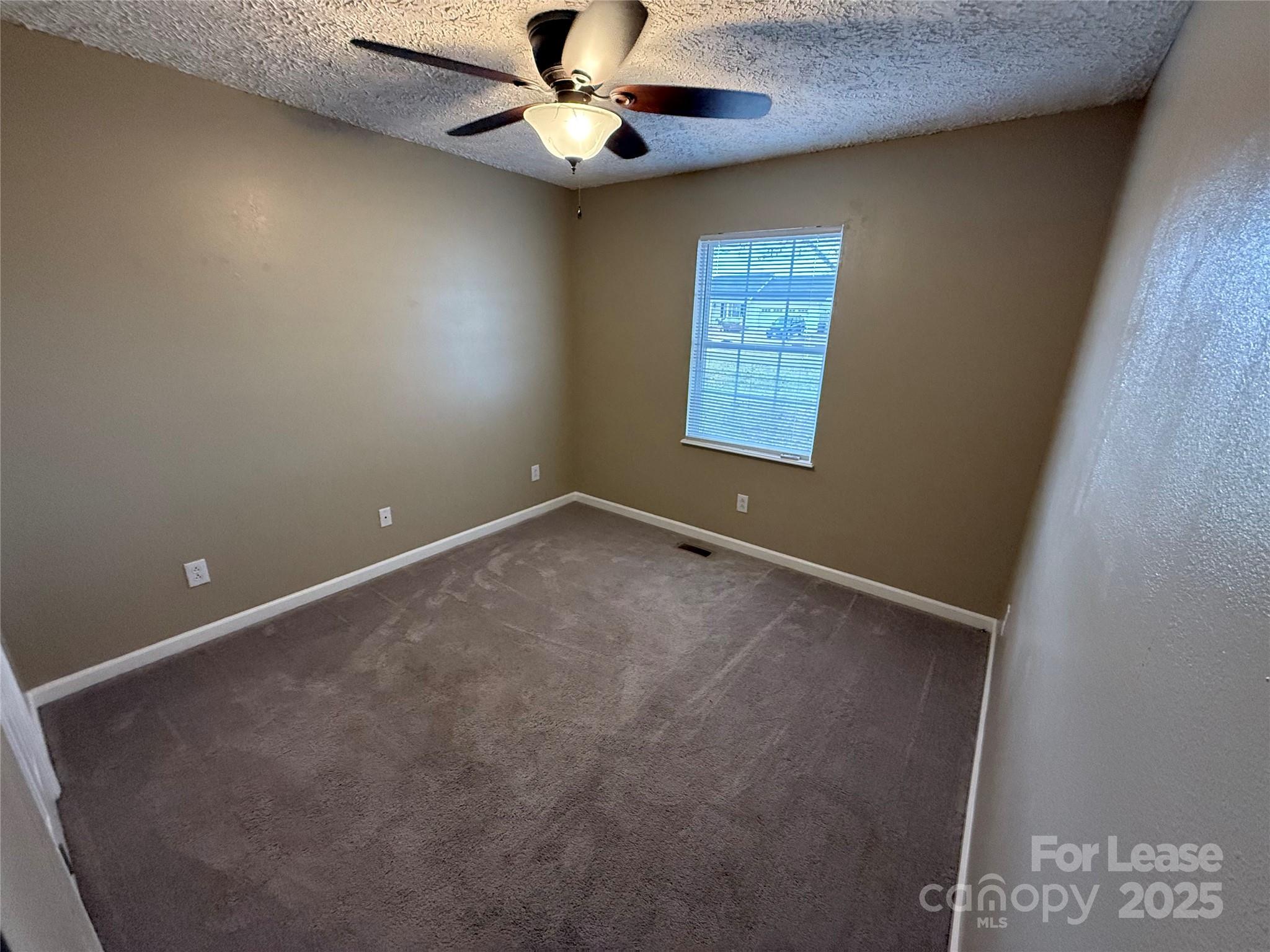 117 Hayworth Lane, Unit 19 Statesville, NC 28625 - Photo 14 of 18 an empty room with a window