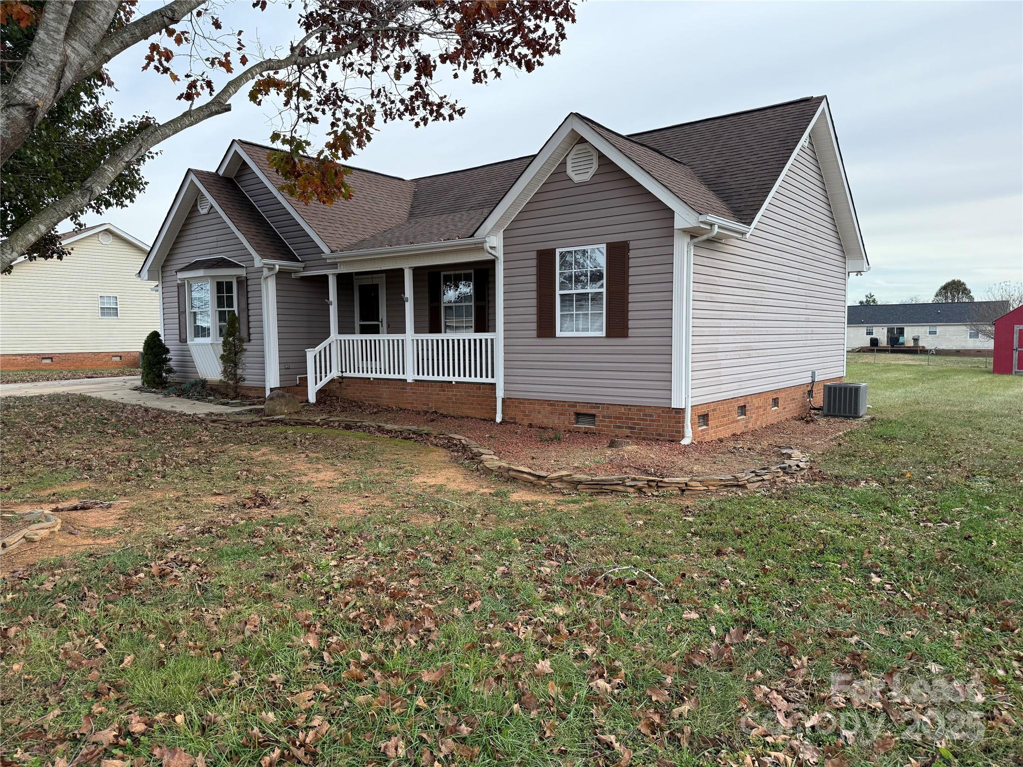 117 Hayworth Lane, Unit 19 Statesville, NC 28625 - Photo 3 of 18 a view of a house with a yard