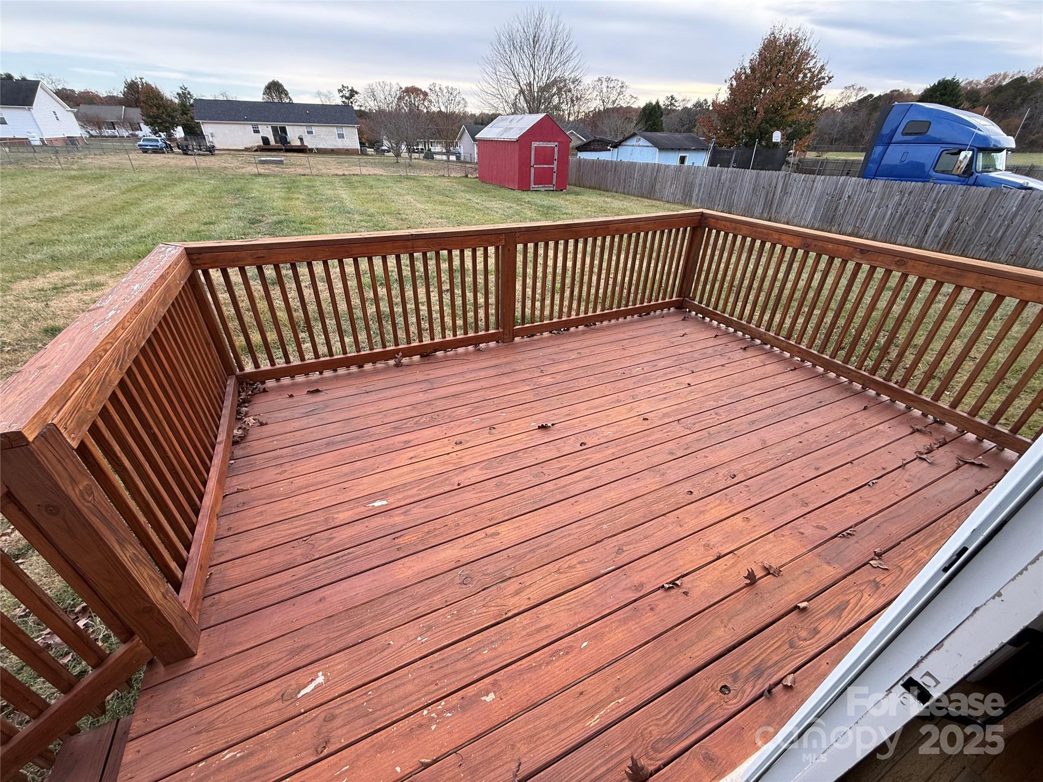 117 Hayworth Lane, Unit 19 Statesville, NC 28625 - Photo 5 of 18 a view of a wooden deck with yard