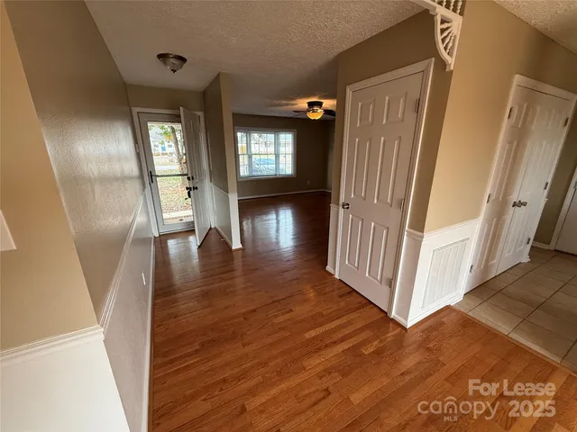 a view of entryway with wooden floor