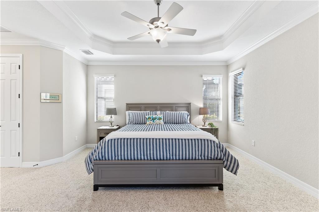 12735 Kinross Lane Naples, FL 34120 - Photo 15 of 37 Primary w/king-size bed