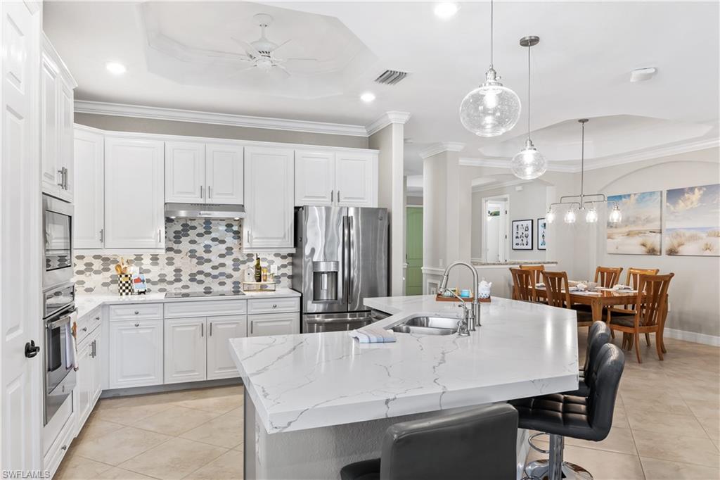 12735 Kinross Lane Naples, FL 34120 - Photo 8 of 37 Extend island/breakfast bar