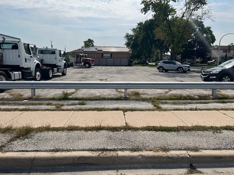a view of a swimming pool with a yard