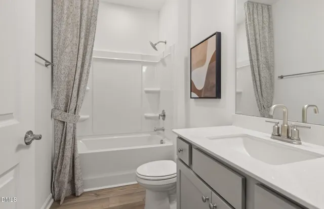 a bedroom with a bed and a desk