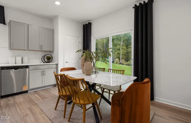 a kitchen with stainless steel appliances a refrigerator sink and microwave
