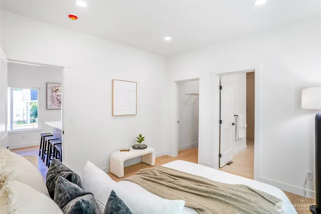 a bedroom with a bed and a couch