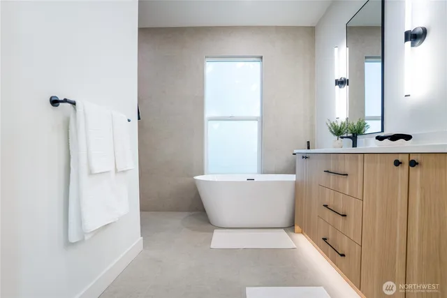 a bathroom with a bathtub and shower