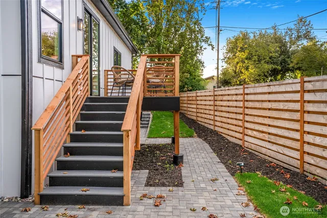 a view of a pathway of a house with a yard