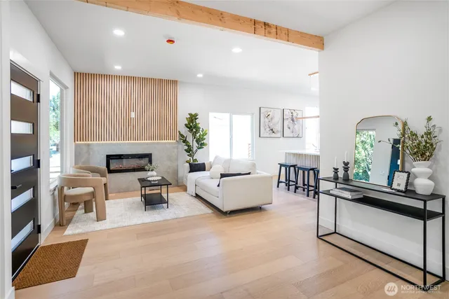a living room with furniture and a potted plant