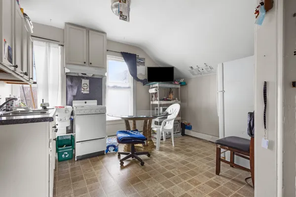 a kitchen with a sink cabinets and appliances