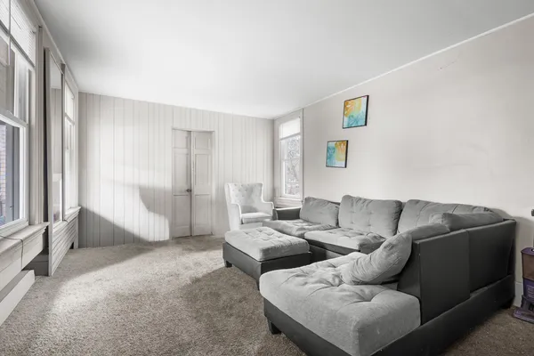 a living room with furniture and a window