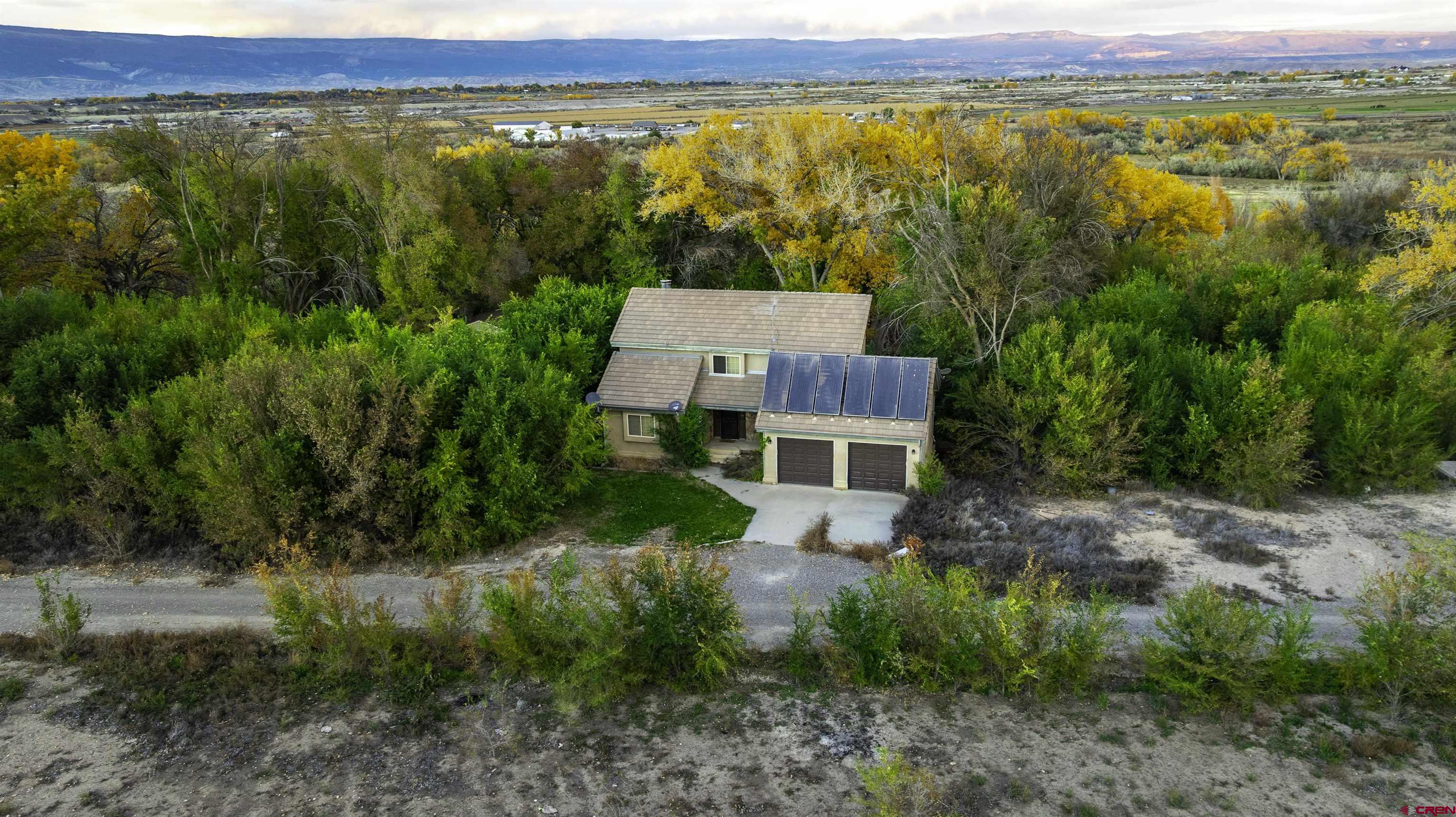 17377 Breeze Road Delta, CO 81416 - Photo 36 of 45 an aerial view of a house with a yard