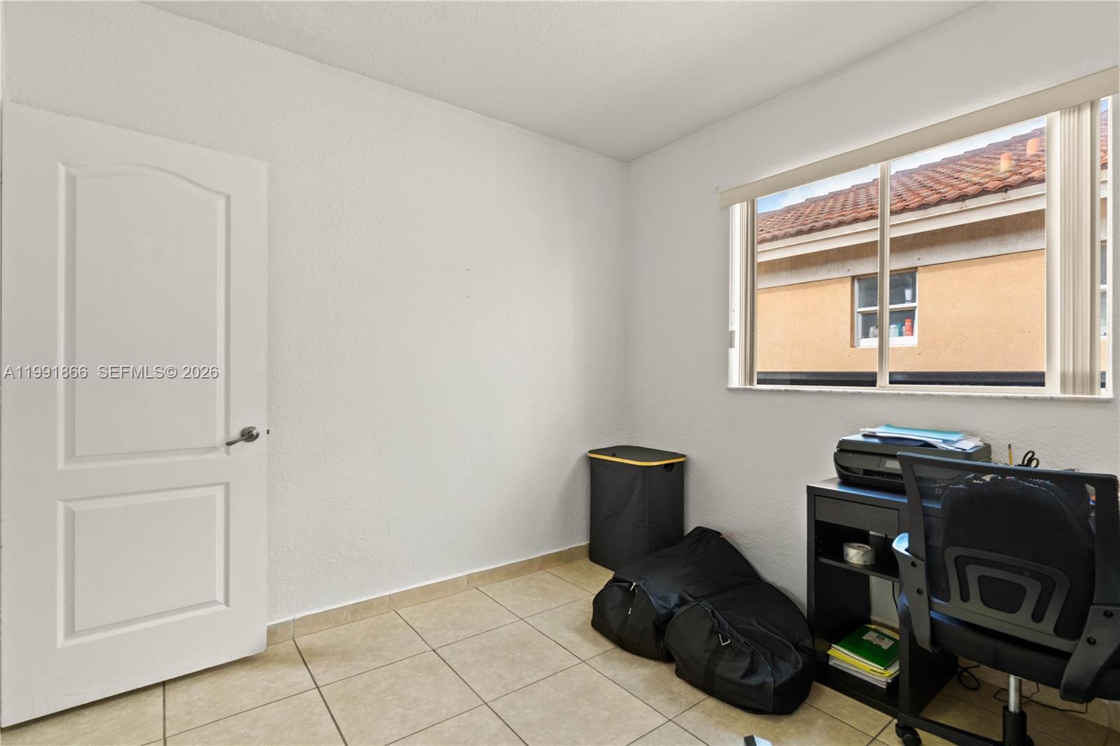 317 East 3rd Street, Unit 201 Hialeah, FL 33010 - Photo 17 of 50 a view of workspace with wooden floor windows