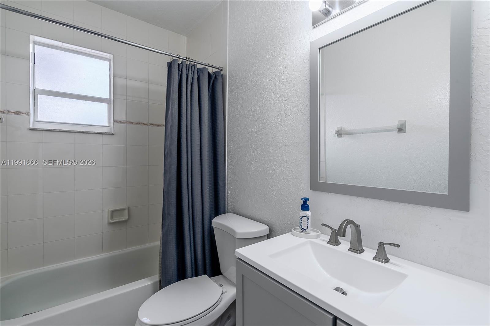 317 East 3rd Street, Unit 201 Hialeah, FL 33010 - Photo 19 of 50 a bathroom with a sink toilet and shower