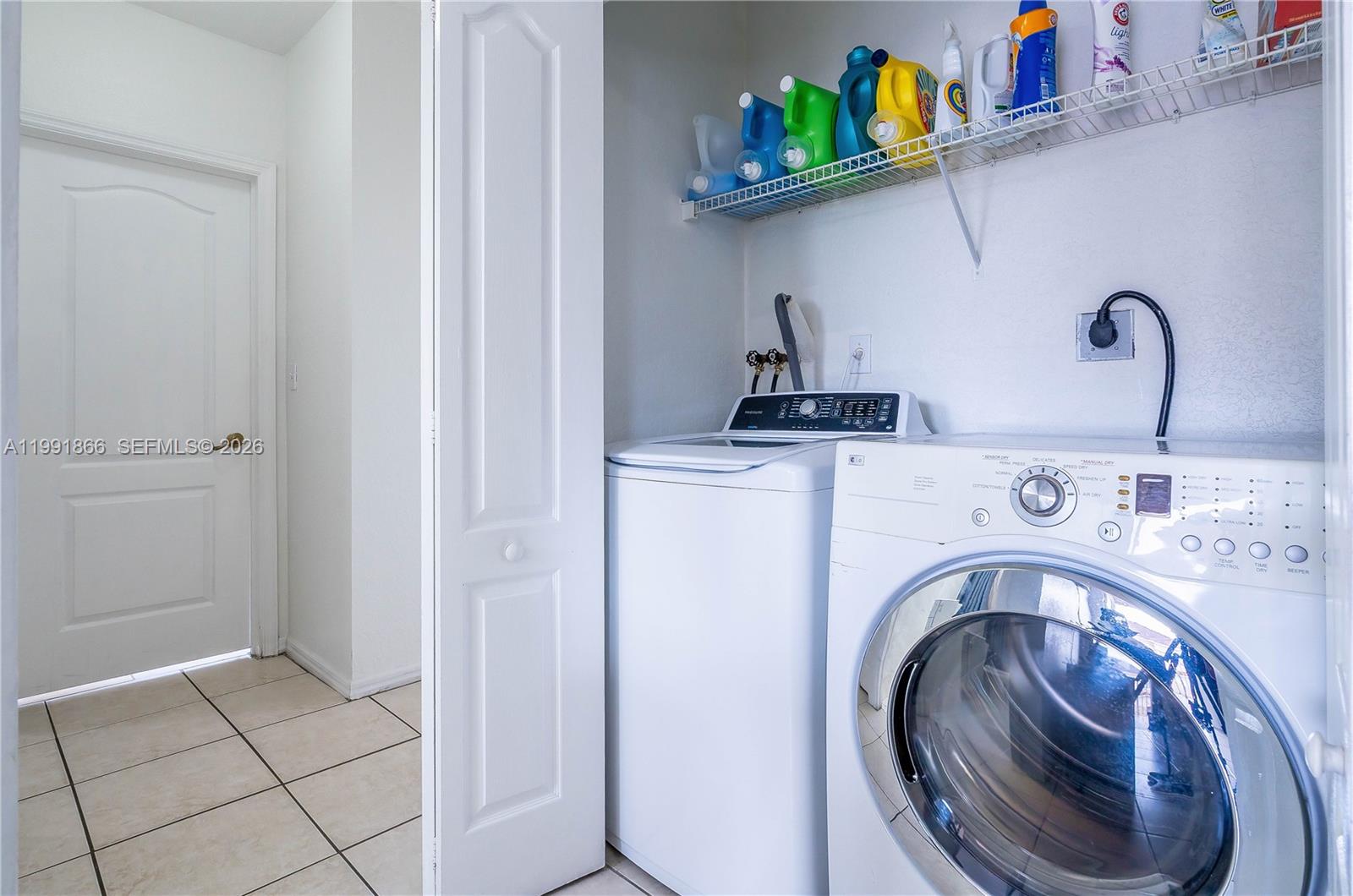 317 East 3rd Street, Unit 201 Hialeah, FL 33010 - Photo 32 of 50 a utility room with dryer and washer