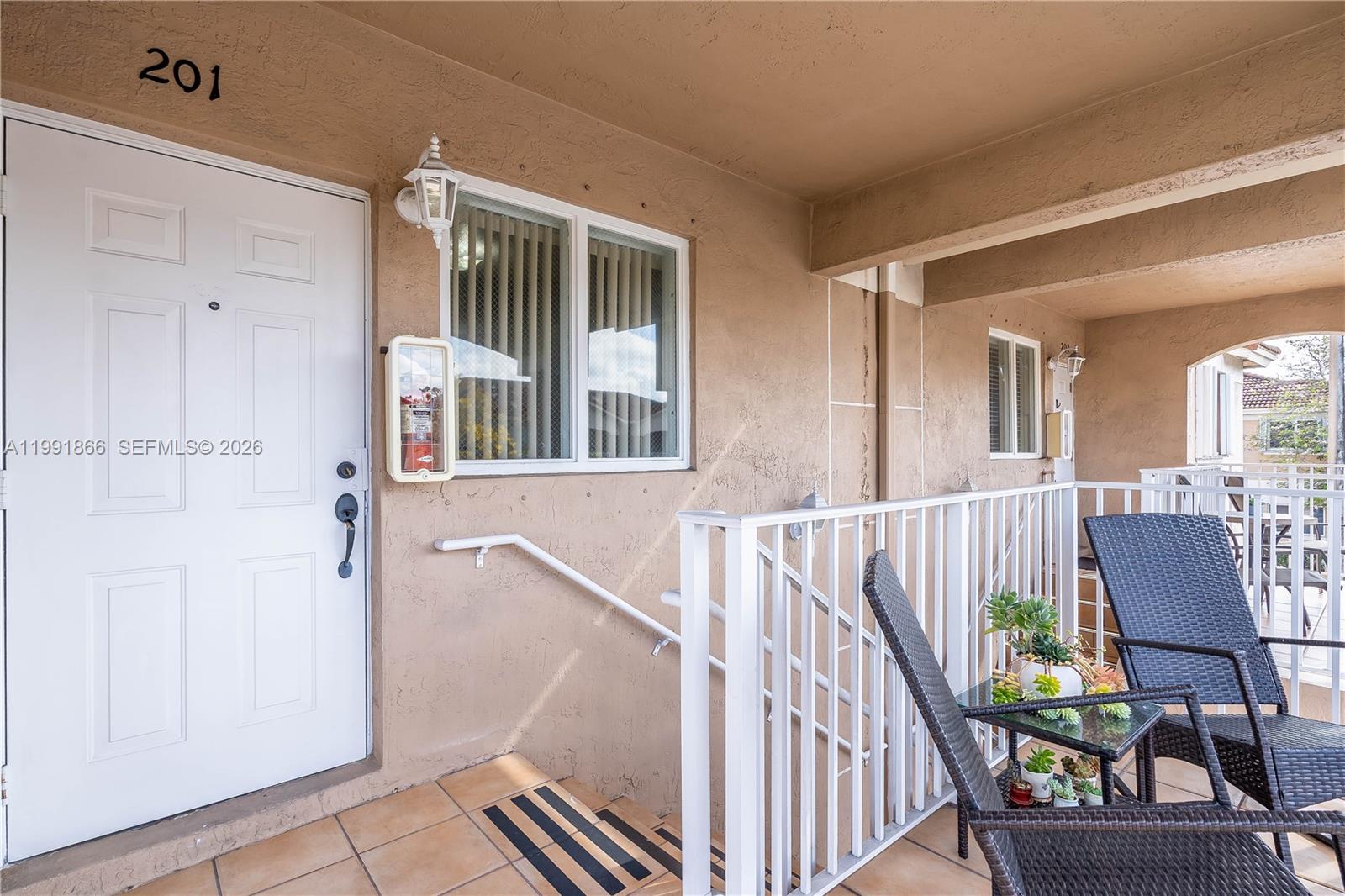317 East 3rd Street, Unit 201 Hialeah, FL 33010 - Photo 36 of 50 a view of livingroom with furniture and windows