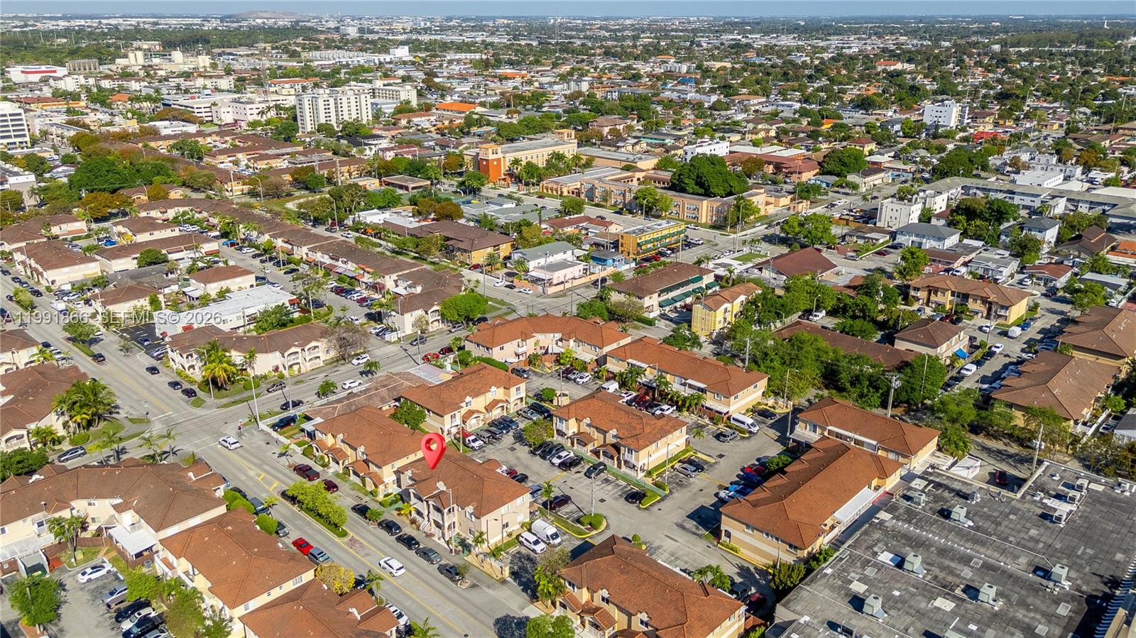 317 East 3rd Street, Unit 201 Hialeah, FL 33010 - Photo 40 of 50 an aerial view of residential building with parking