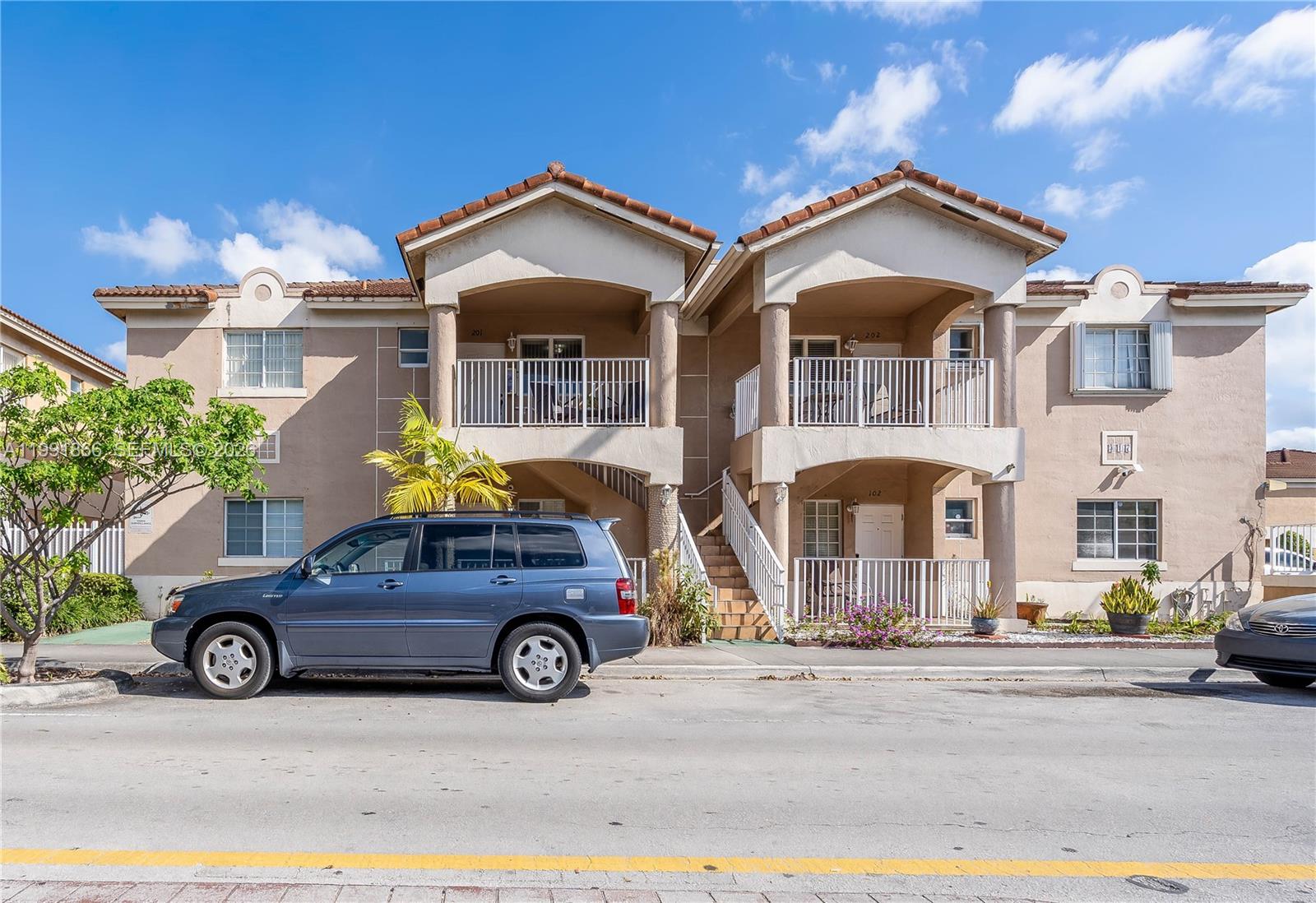 317 East 3rd Street, Unit 201 Hialeah, FL 33010 - Photo 48 of 50 a car parked in front of a house