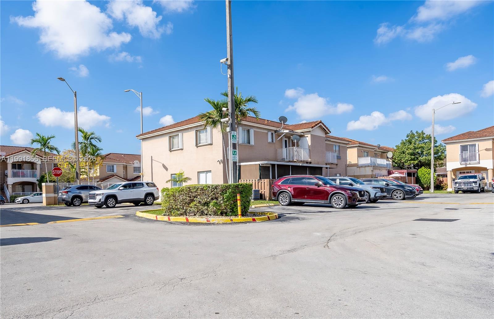 317 East 3rd Street, Unit 201 Hialeah, FL 33010 - Photo 49 of 50 a car parked in front of a house