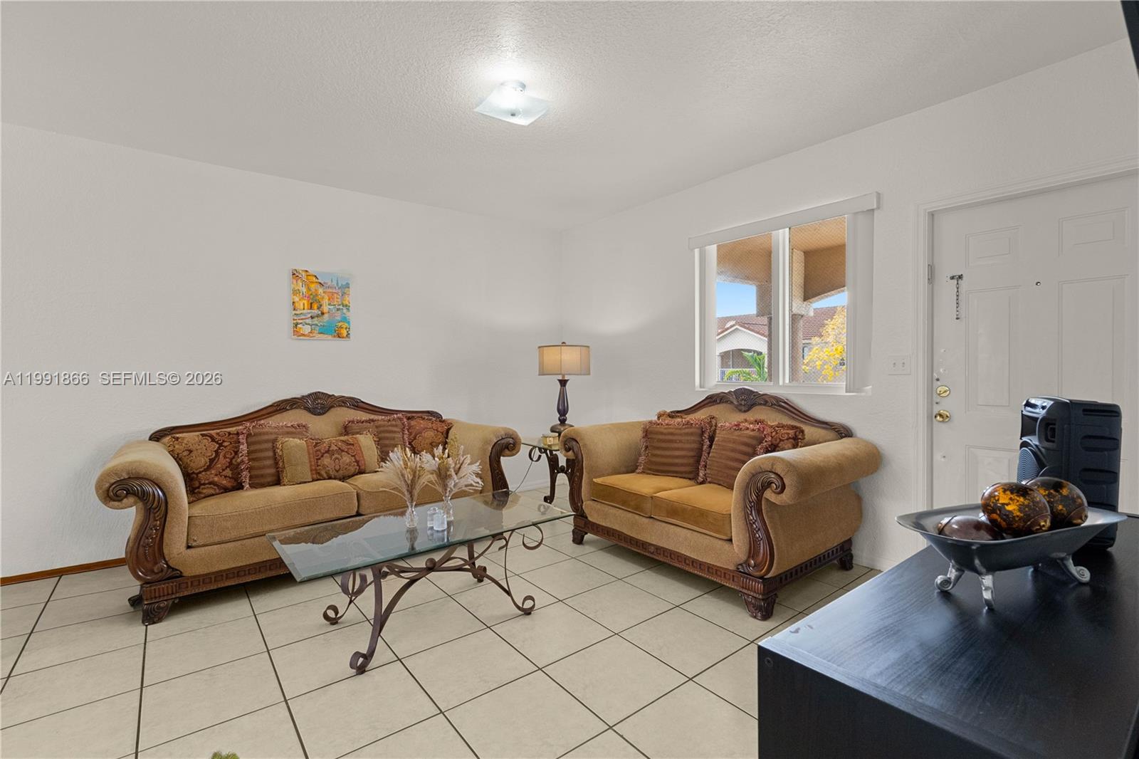 317 East 3rd Street, Unit 201 Hialeah, FL 33010 - Photo 6 of 50 a living room with furniture and a couch
