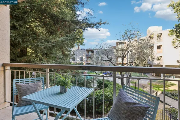 a view of a balcony with furniture