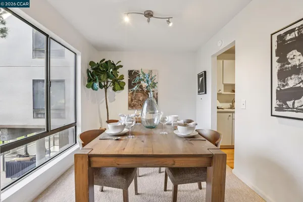 a view of a dining room with furniture window and wooden floor