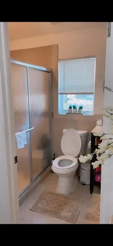 a bathroom with a toilet and a sink