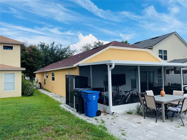a front view of a house with chairs