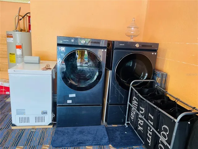 an aerial view of a house with a swimming pool yard and outdoor seating