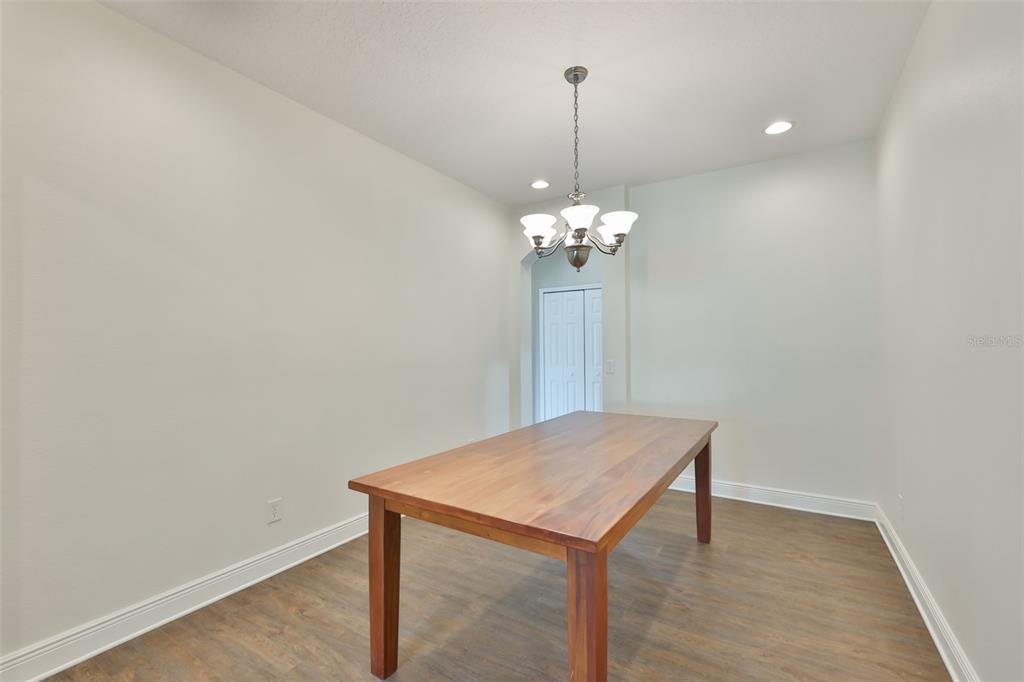 708 Coade Stone Drive Seffner, FL 33584 - Photo 17 of 48 a view of a room with a table and chairs