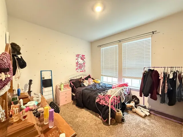 a bed room with furniture and a window