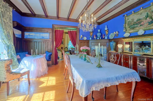 a kitchen with cabinets and wooden floor